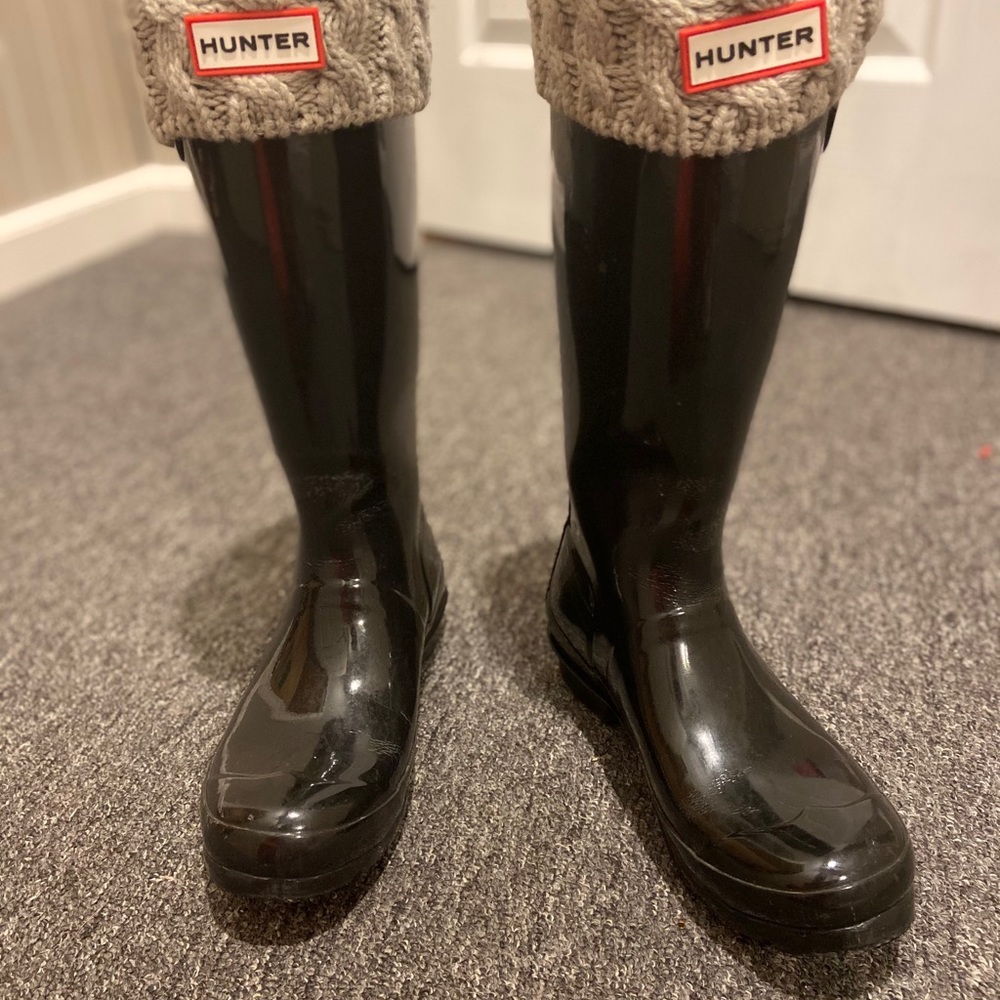 Tall black hunter boots